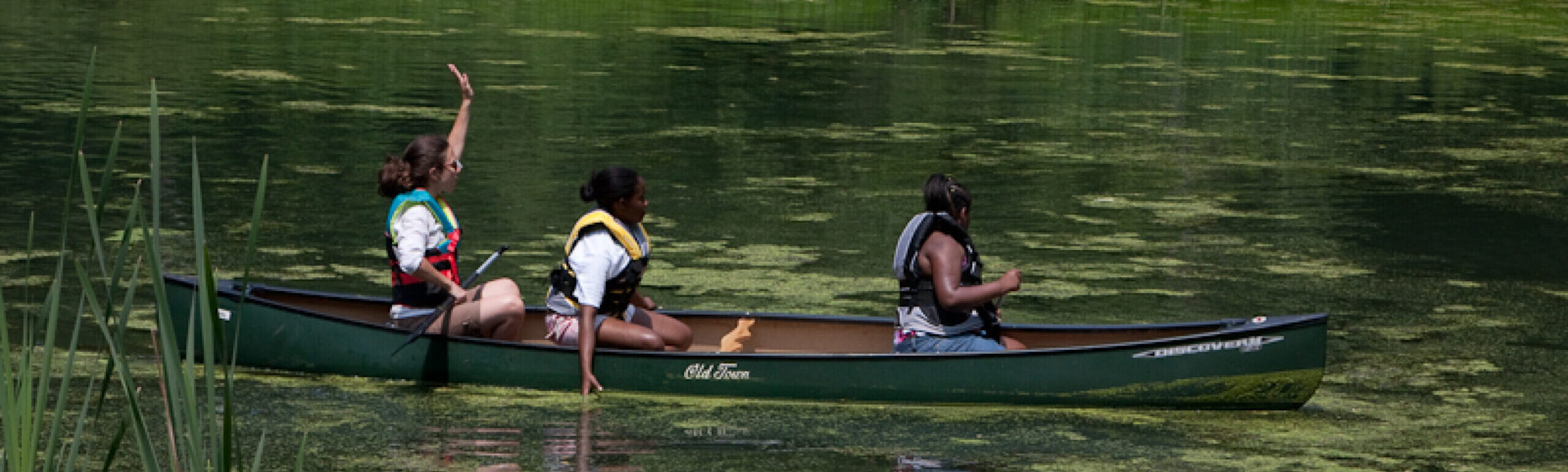 Three kids canoeing